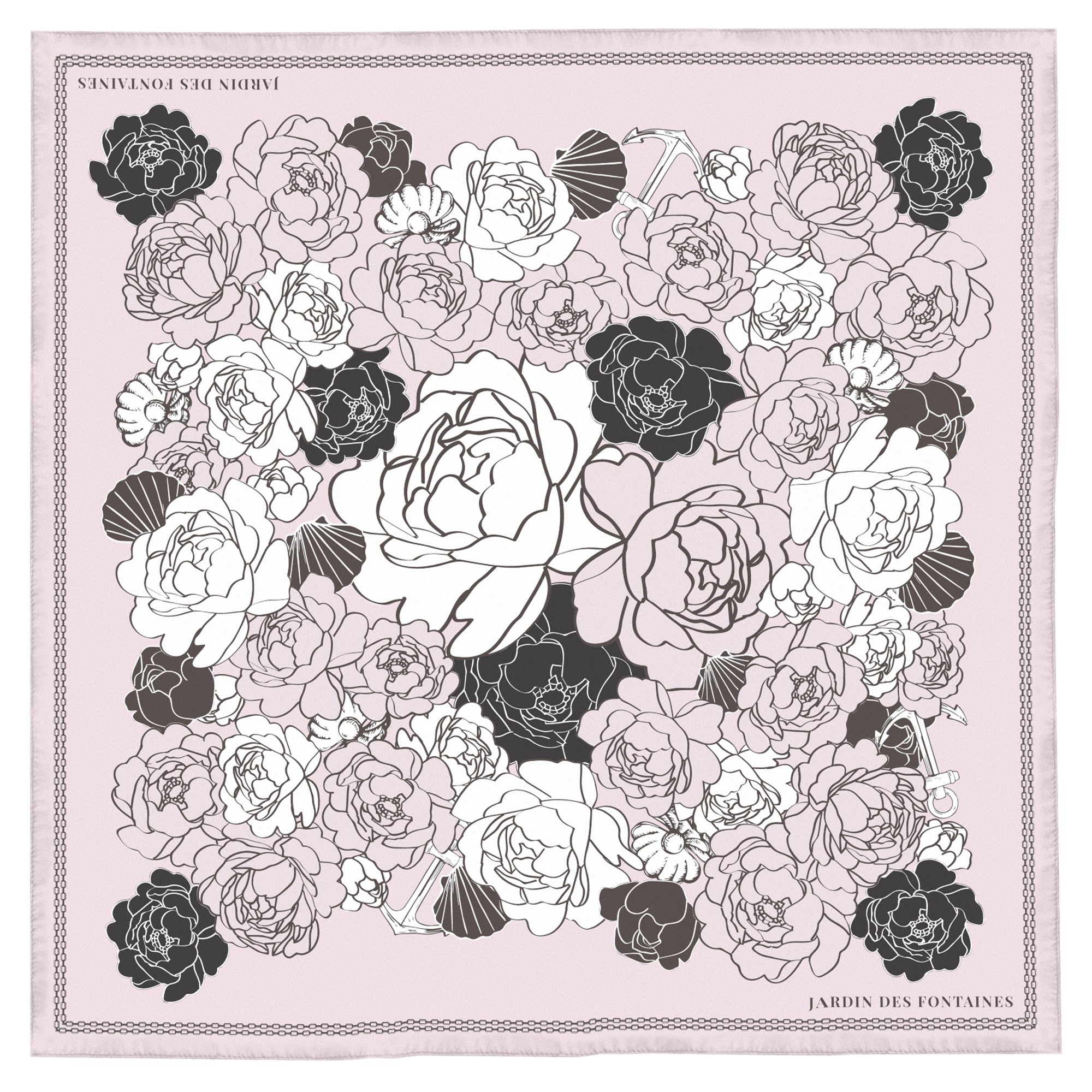 Floral patterned fabric with black and white flowers on a light pink background