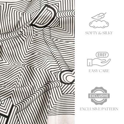 Black and white patterned fabric with softy, silky, easy care, and exclusive pattern text.