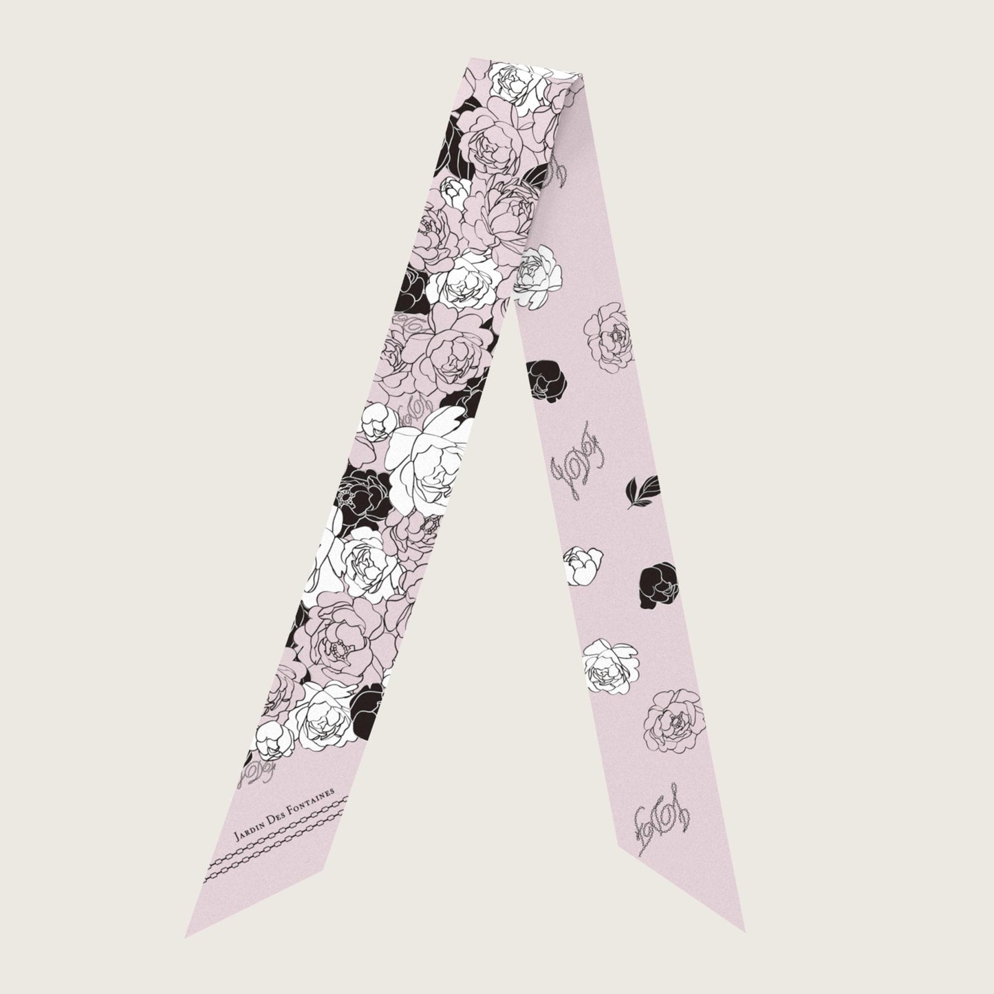 Floral patterned scarf on a light pink background