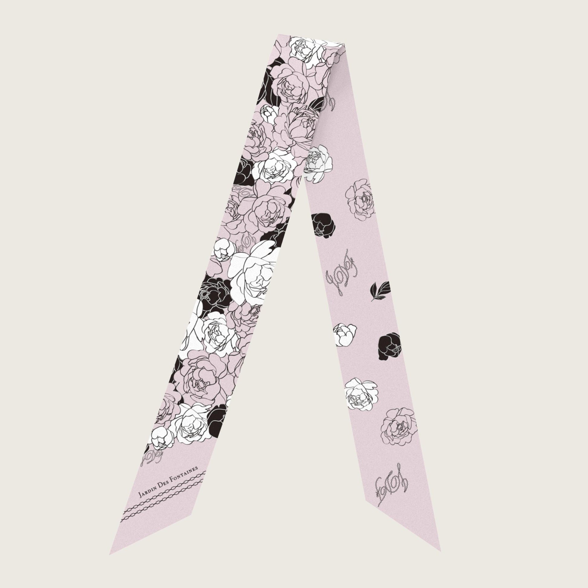 Floral patterned scarf on a light pink background